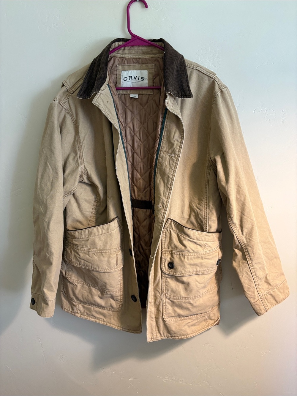 Orvis canvas barn coat with corduroy trim. Button closure. Quilted lining. Sz m